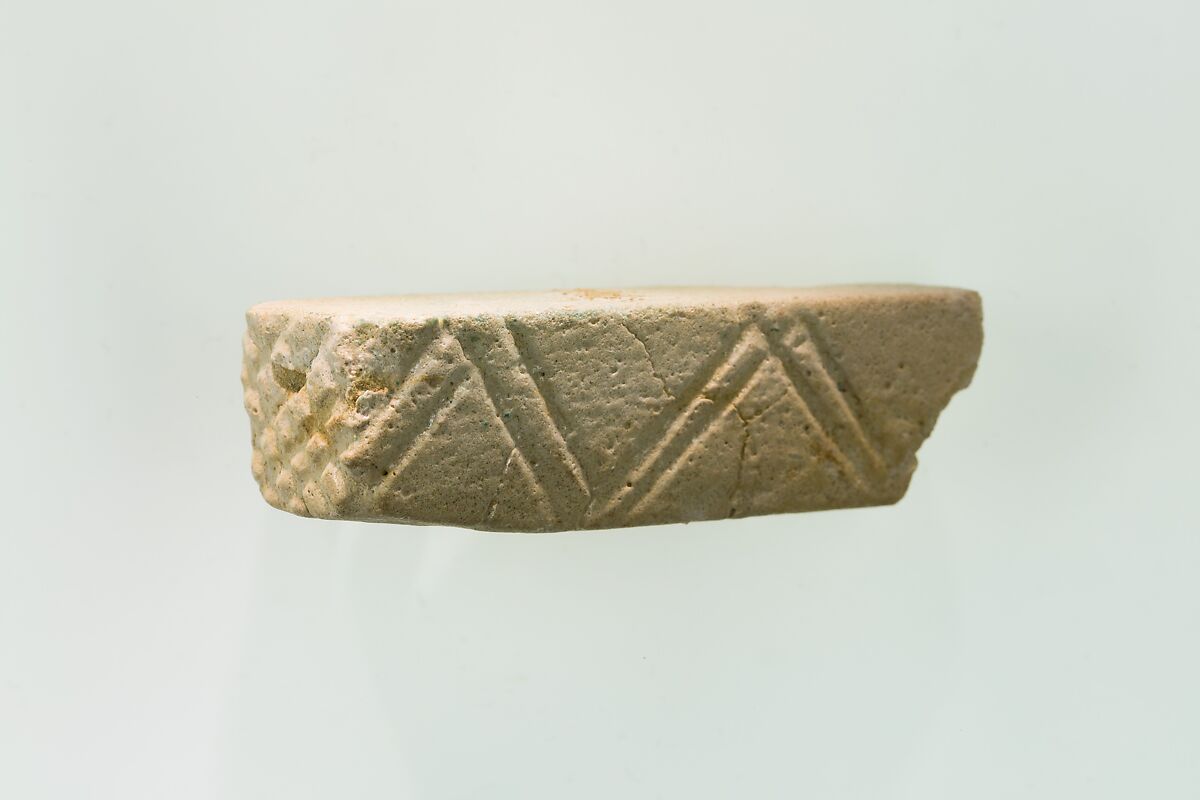 A fragment of a cubic unknown object, possibly a fragment of a rod, White faience