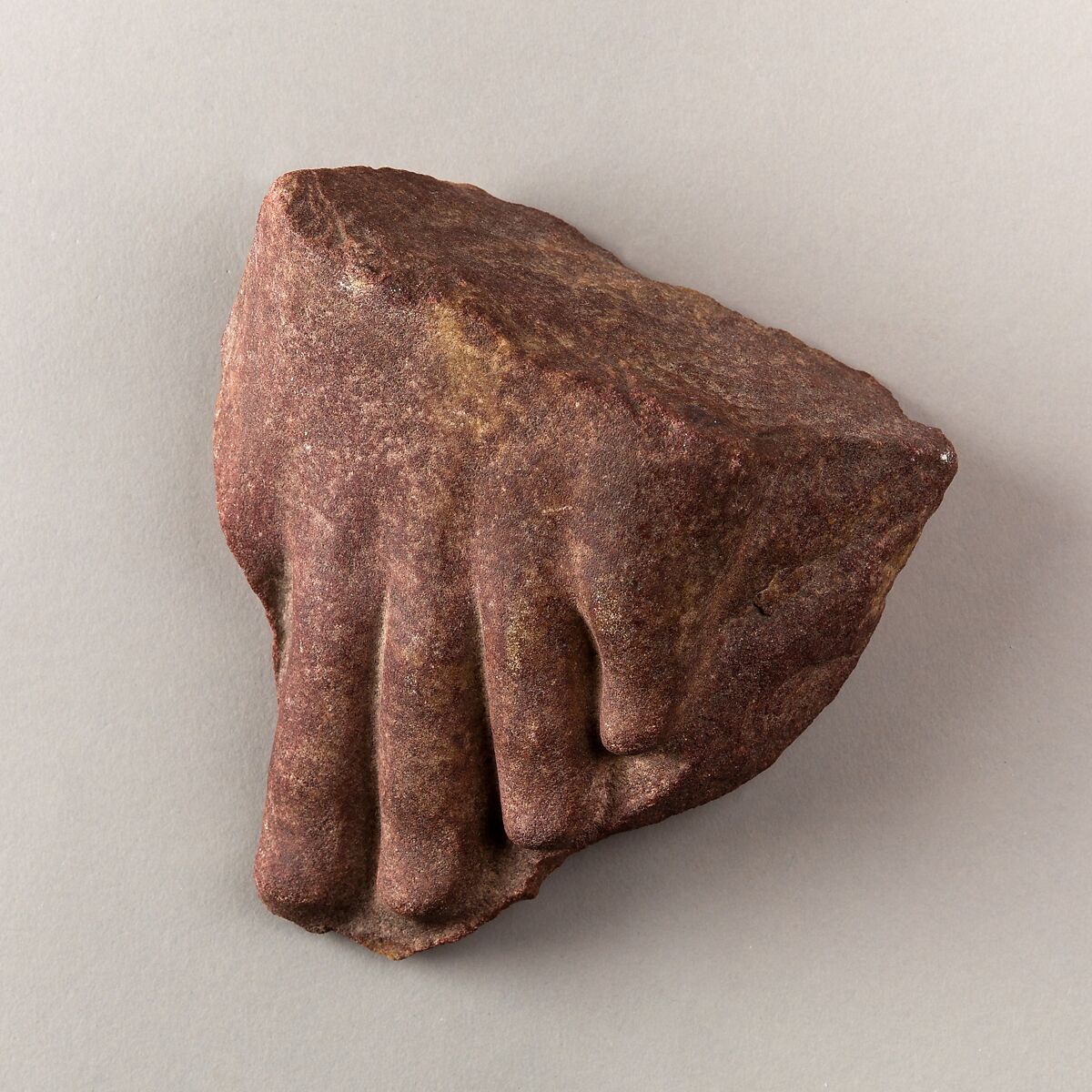 toes from left foot of a statue, Red quartzite