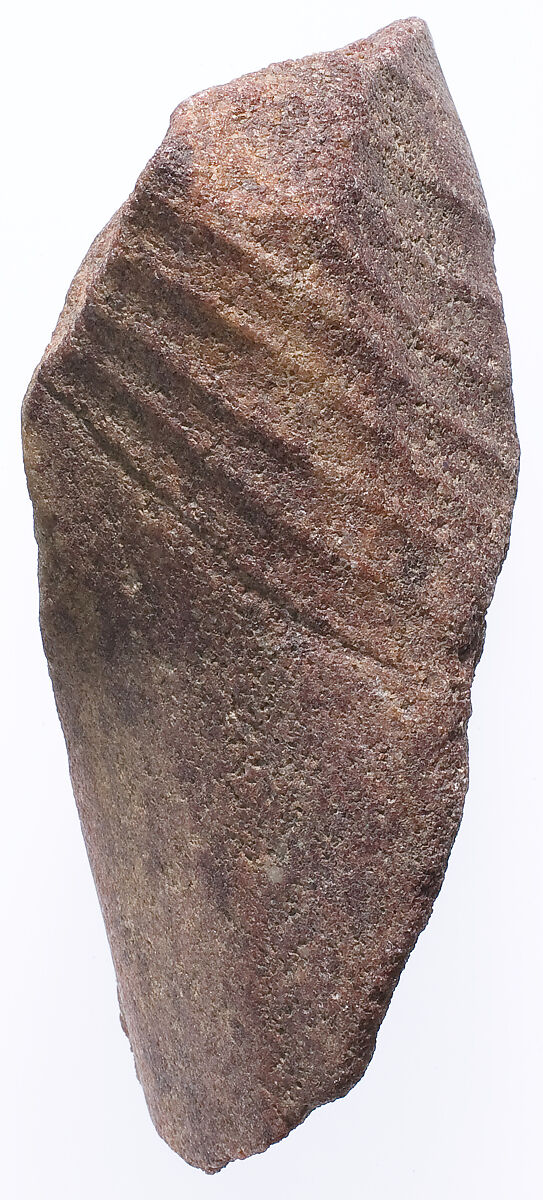 Section of the left leg from a small striding statue, Red quartzite 