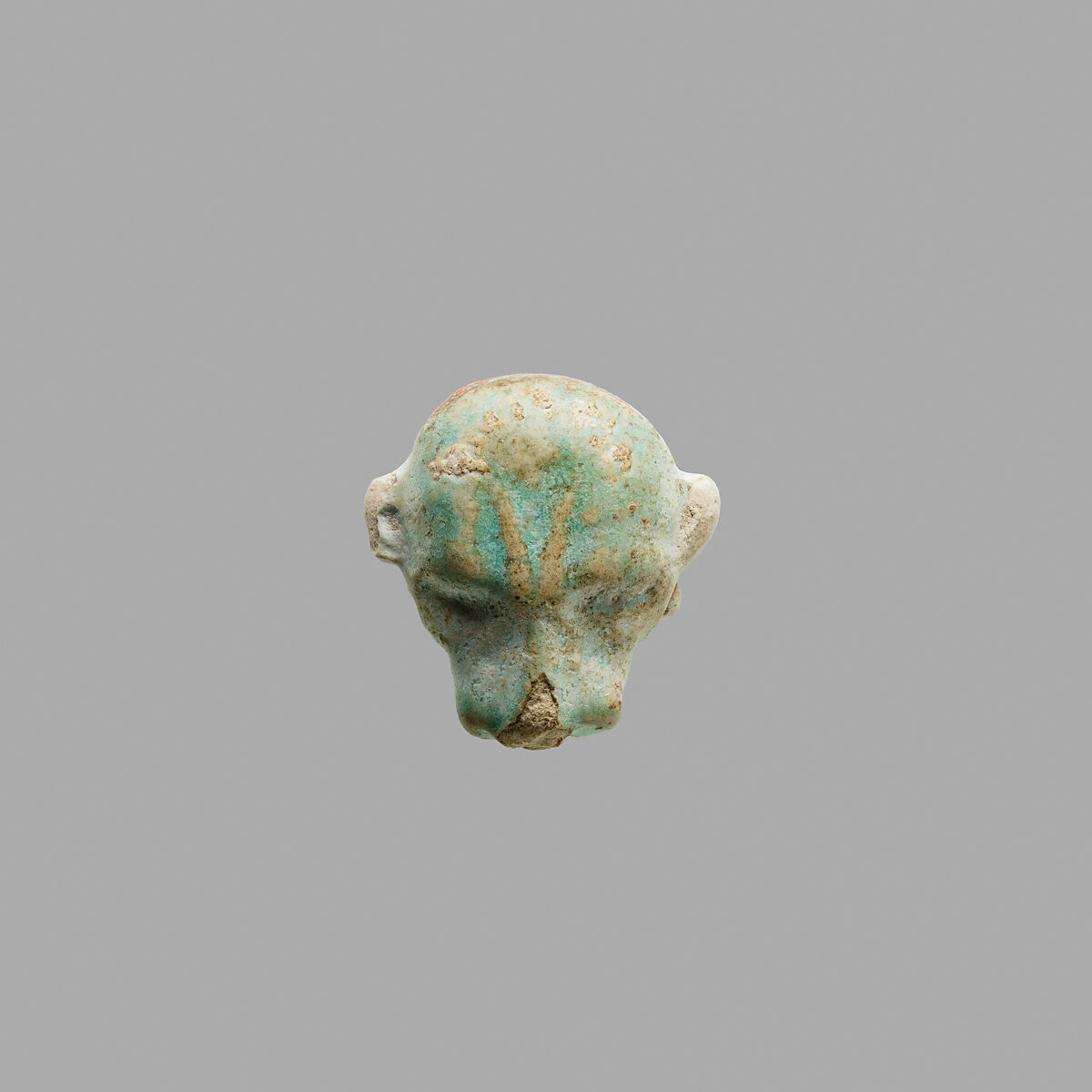 Bead in form of a head of a leopard, Faience 