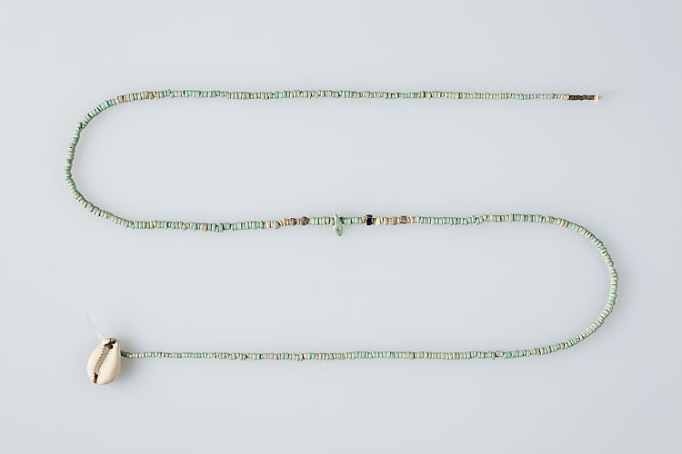 String of beads with shell pendant
