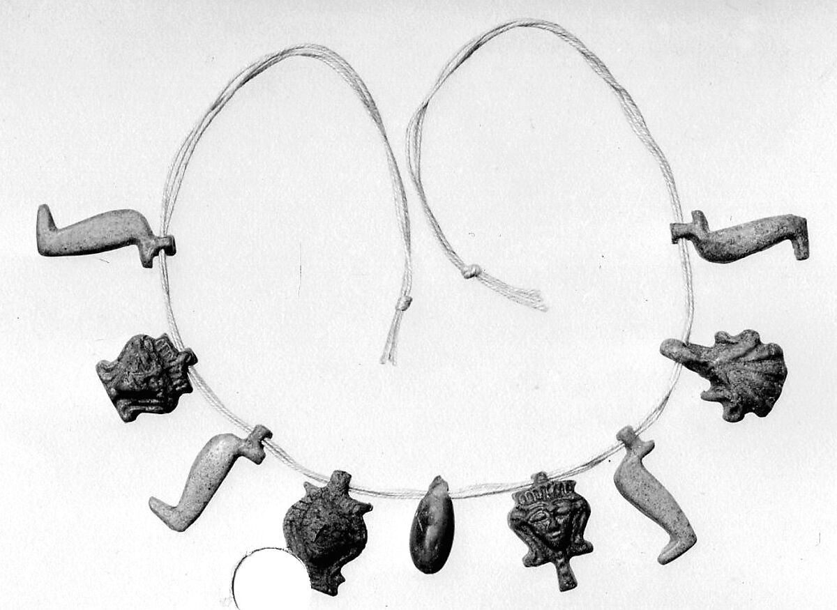 String of amulets, Faience, carnelian 
