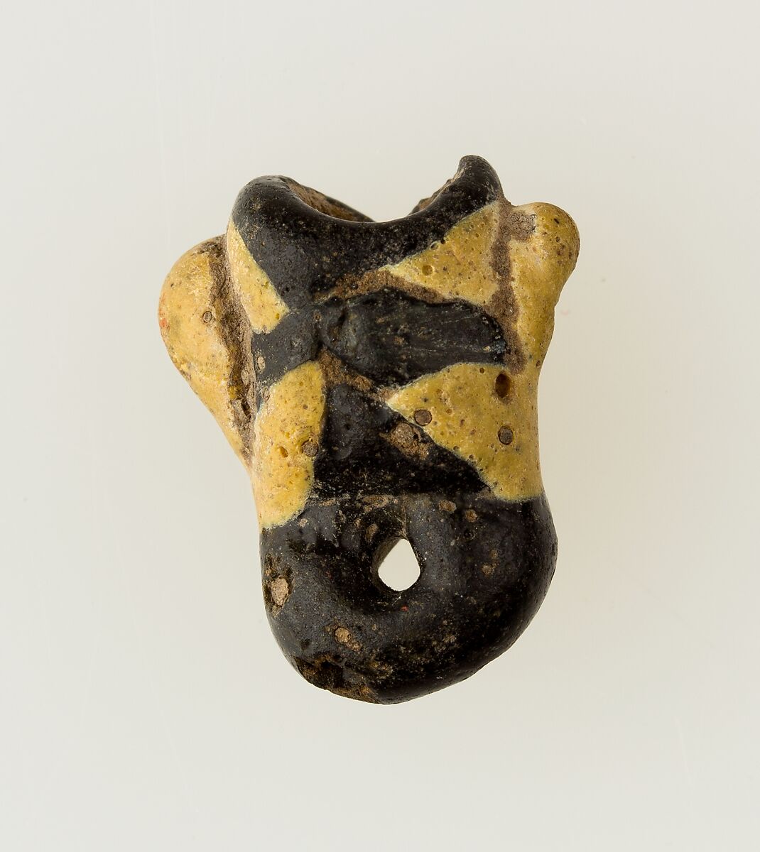 Amulet in form of human face, Glass 