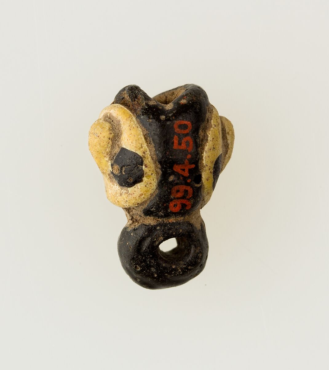 Amulet in form of human face, Glass