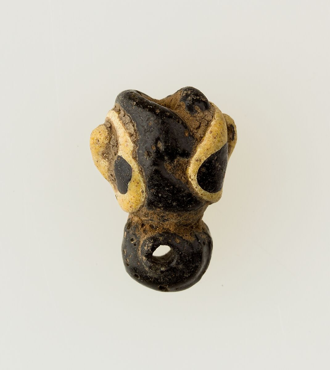 Amulet in form of human face, Glass 