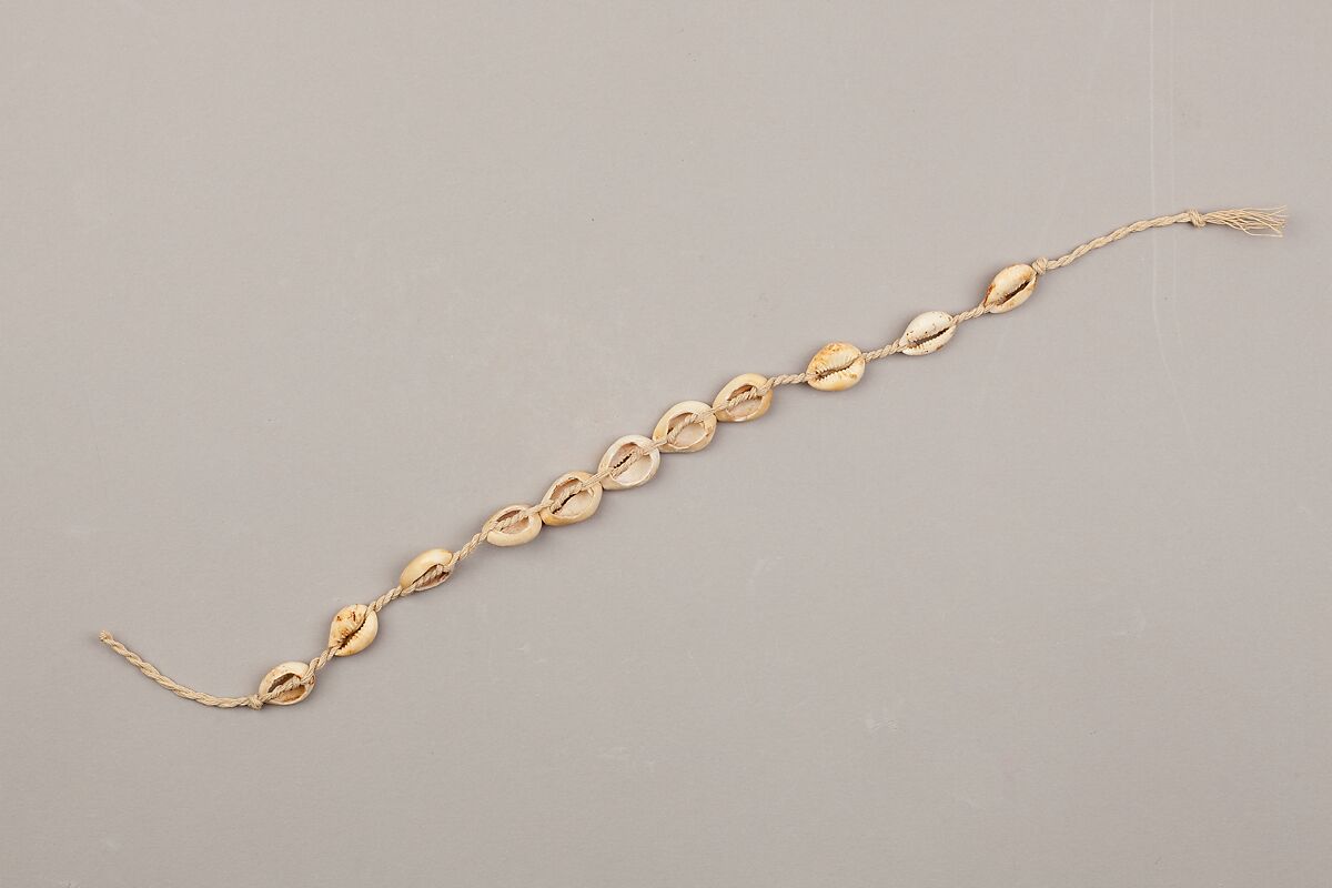 String of cowrie shell beads on fiber, Cowrie shells, fiber 