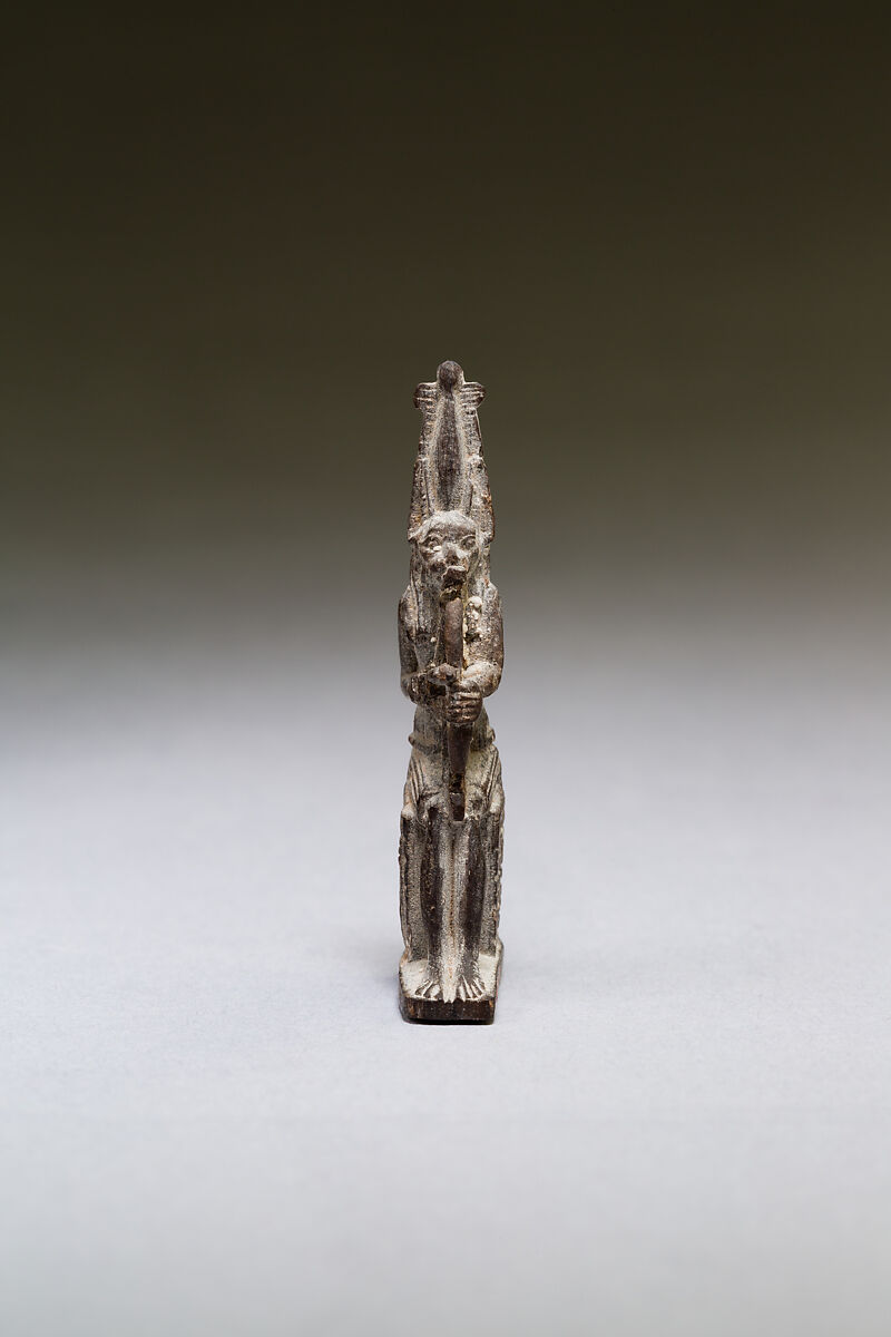 Seated polymorphic figure of jackal-headed archer, Wood