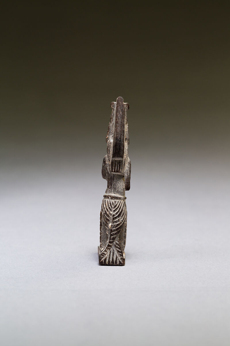 Seated polymorphic figure of jackal-headed archer, Wood