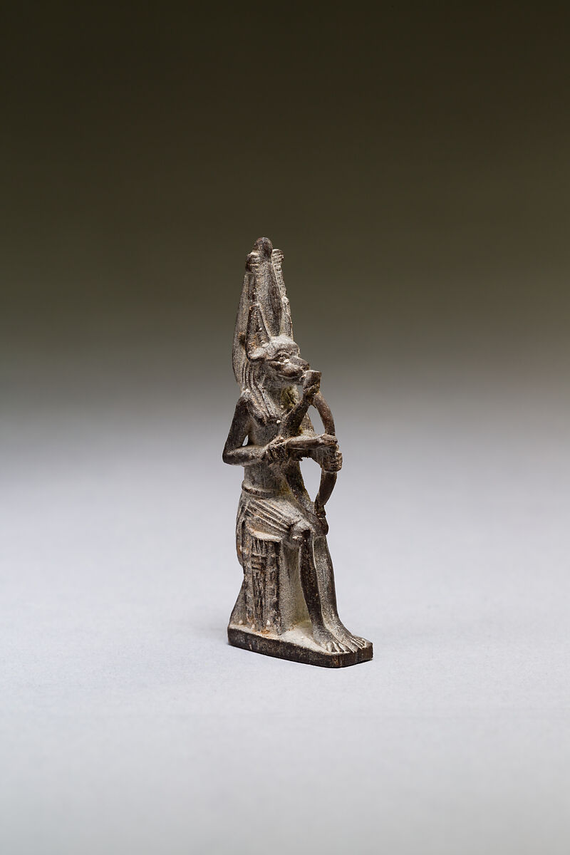 Seated polymorphic figure of jackal-headed archer, Wood 