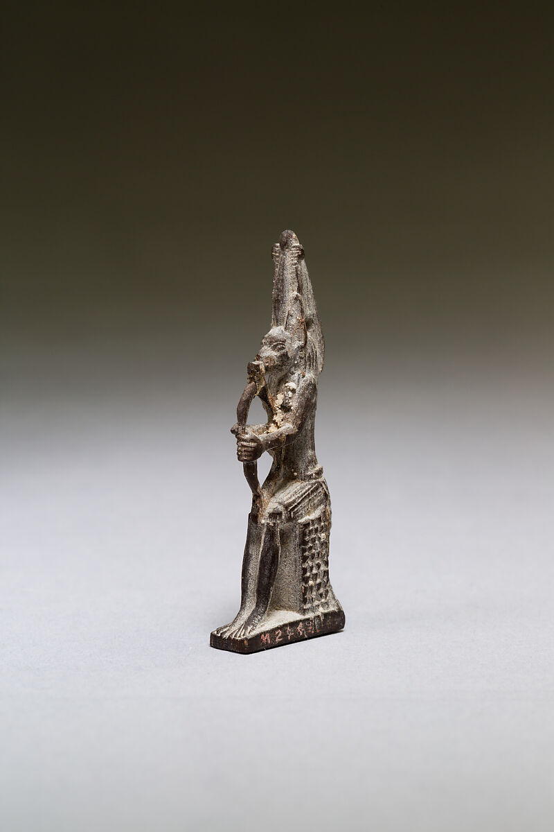 Seated polymorphic figure of jackal-headed archer, Wood