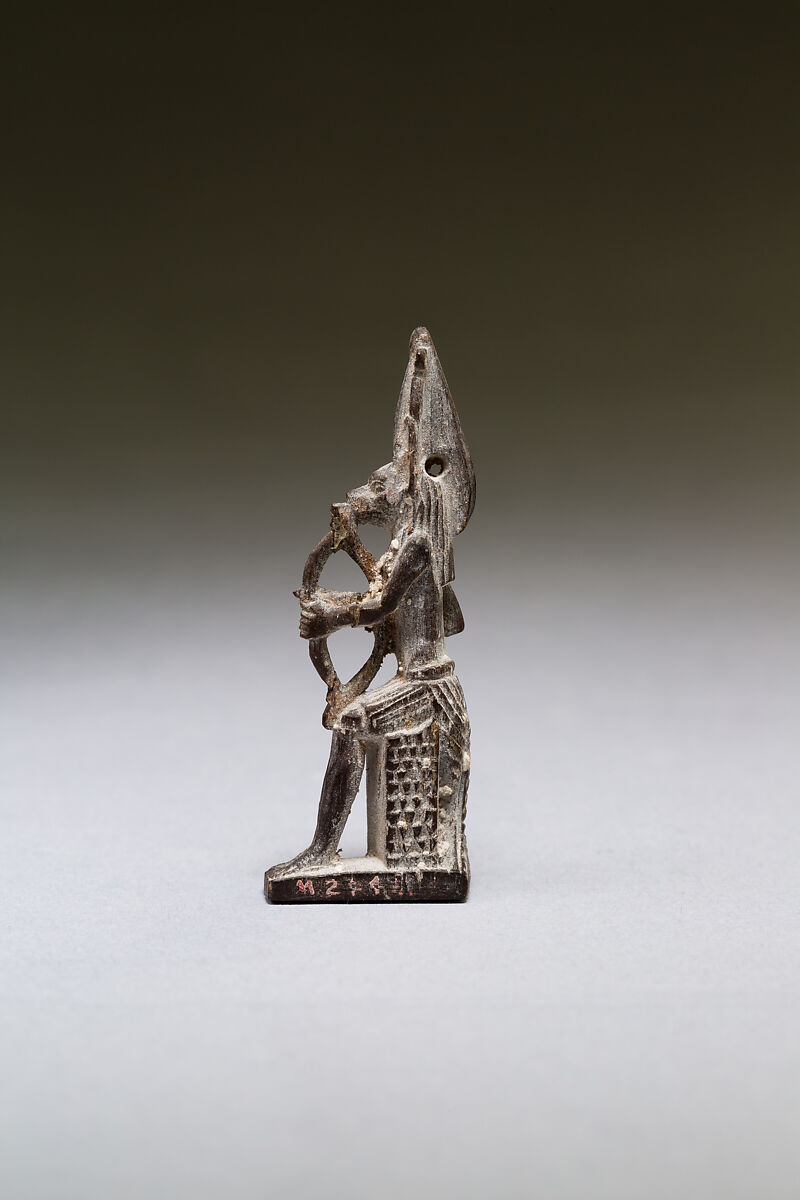 Seated polymorphic figure of jackal-headed archer, Wood