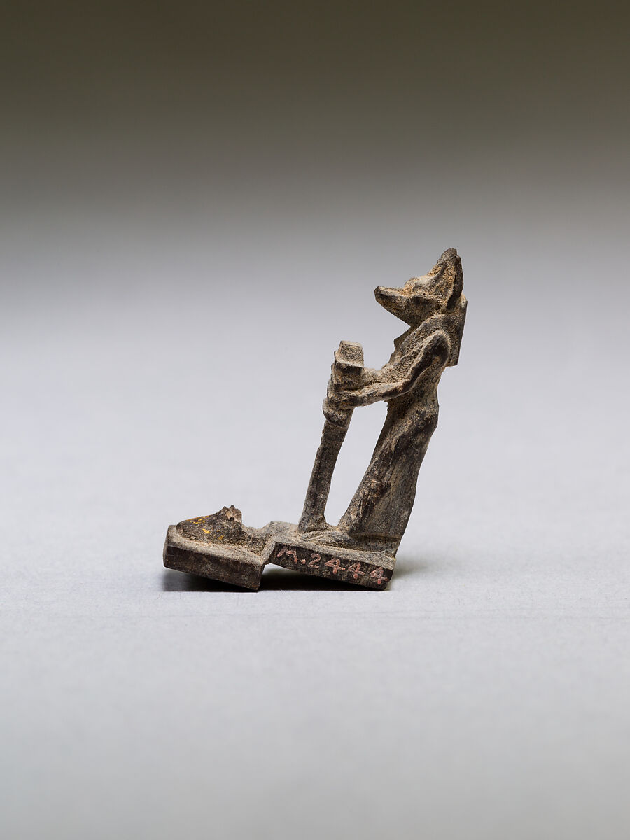 Anubis (?) supporting a large djed pillar, wood