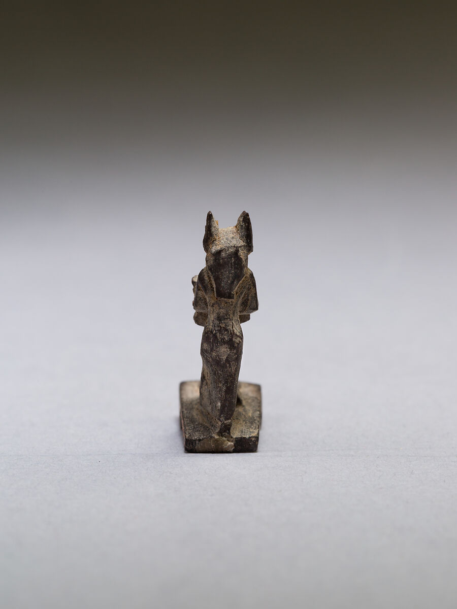 Anubis (?) supporting a large djed pillar, wood