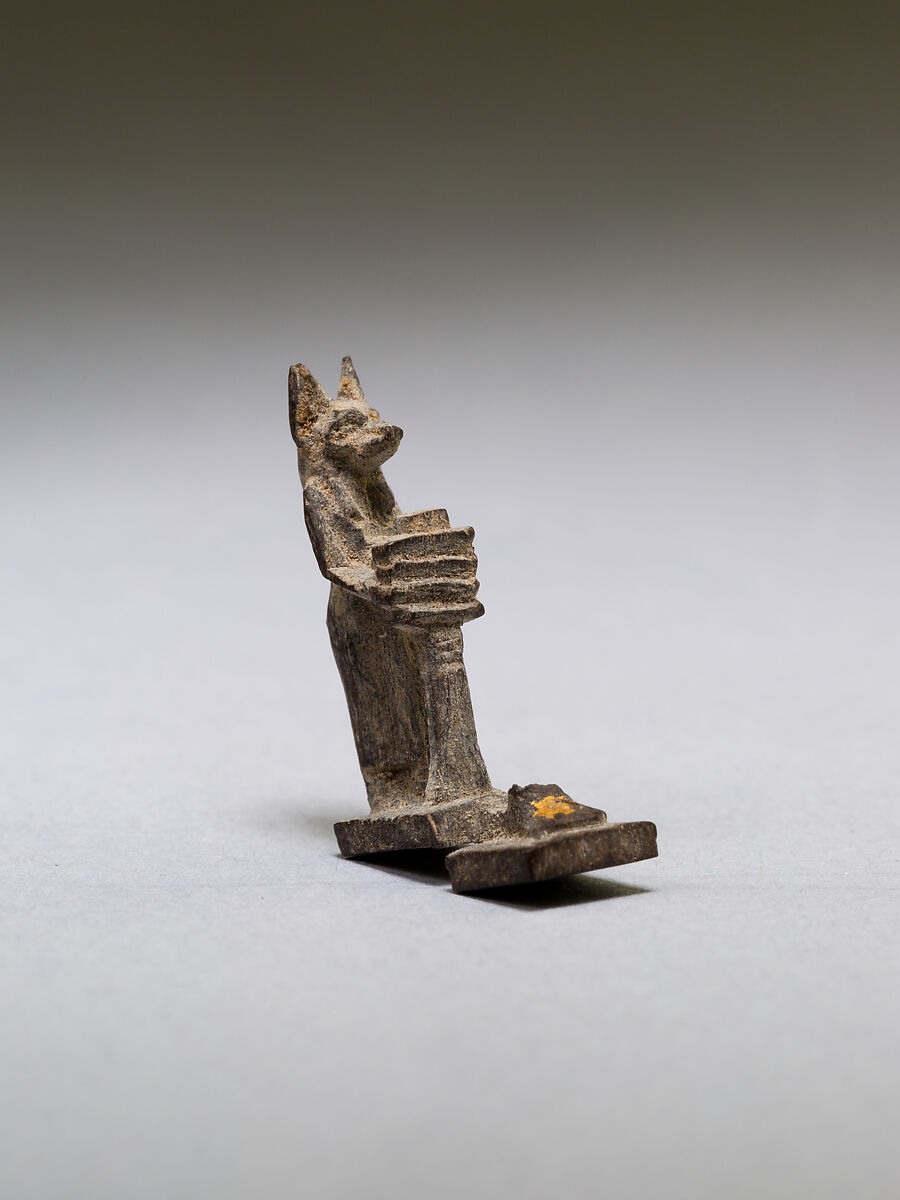 Anubis (?) supporting a large djed pillar, wood