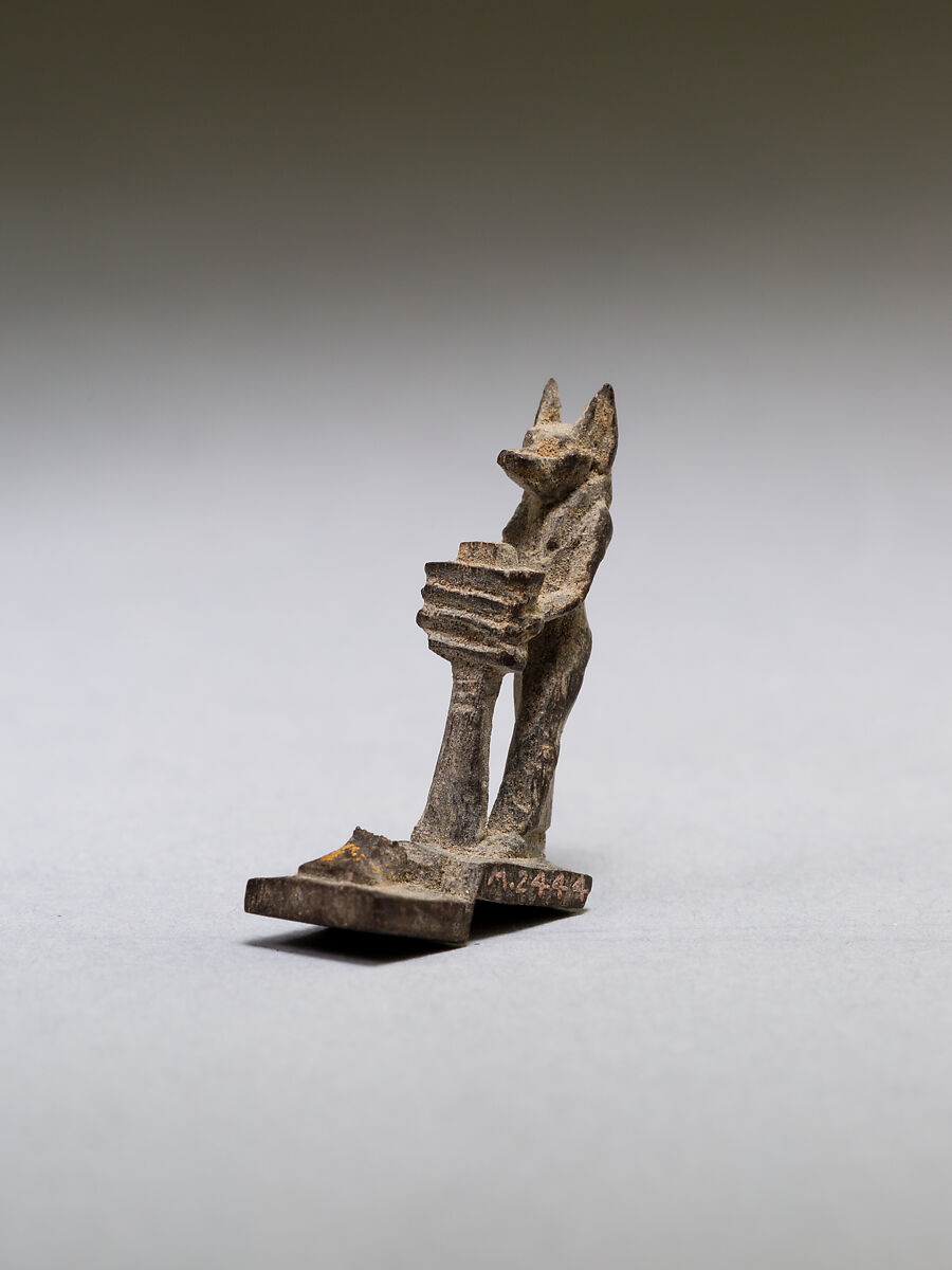 Anubis (?) supporting a large djed pillar, wood
