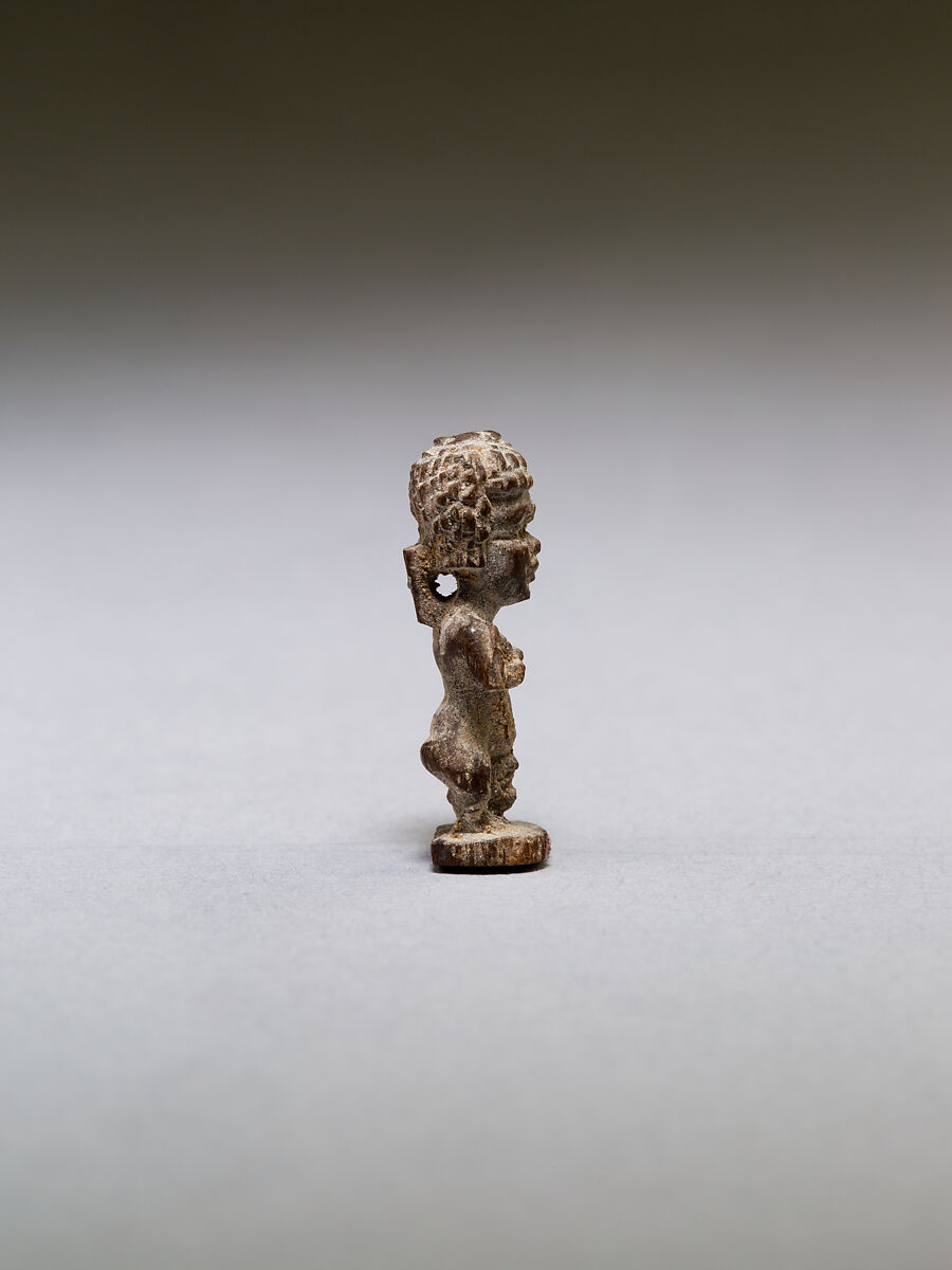 Pataikos or other dwarf god, with curly hair, wood
