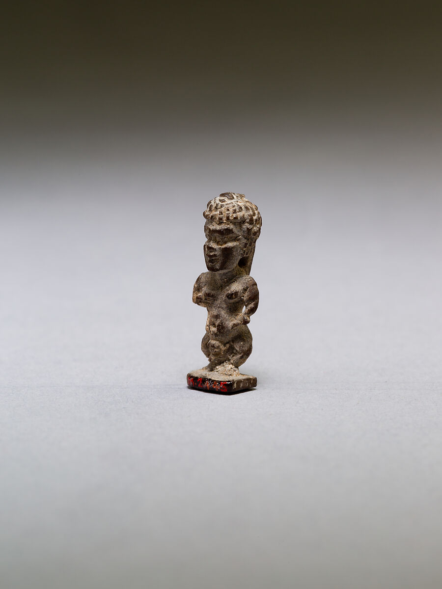 Pataikos or other dwarf god, with curly hair, wood