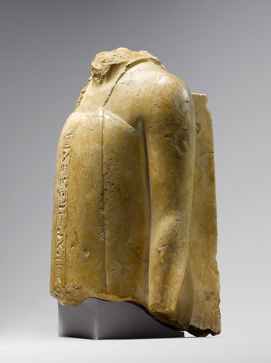 Fragmentary Statuette of a Vizier, Indurated limestone
