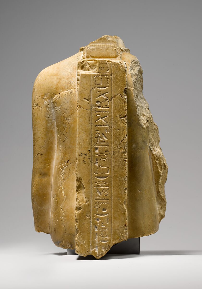 Fragmentary Statuette of a Vizier, Indurated limestone