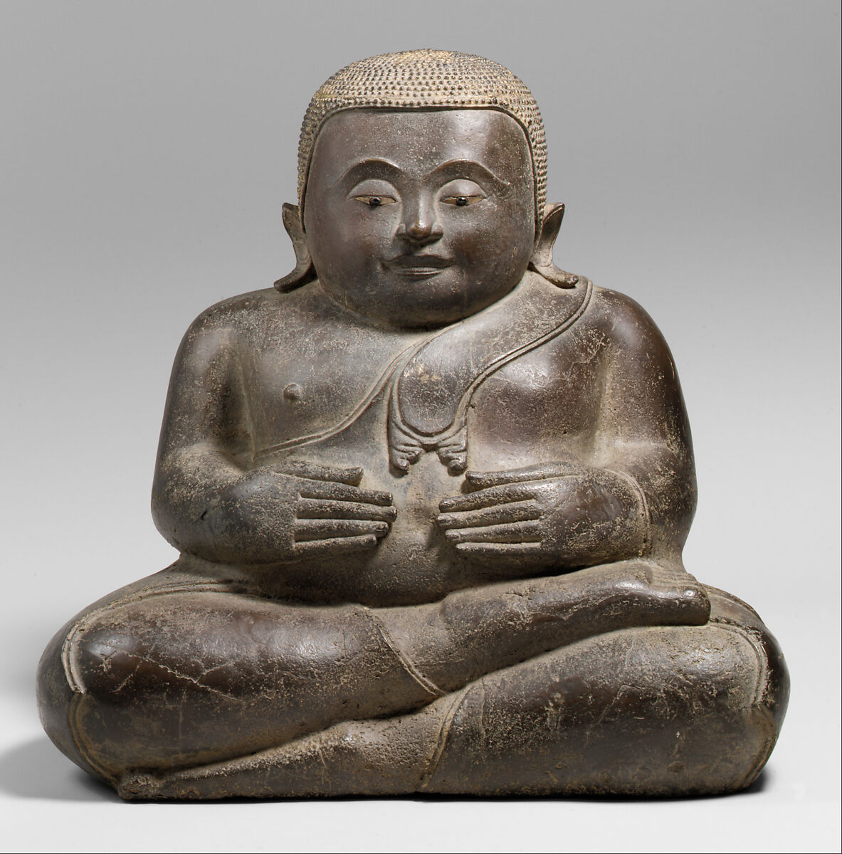 The Buddhist Disciple Phra Sankachai, Bronze with traces of gilt; eyes inlaid with shell and garnet, Thailand 