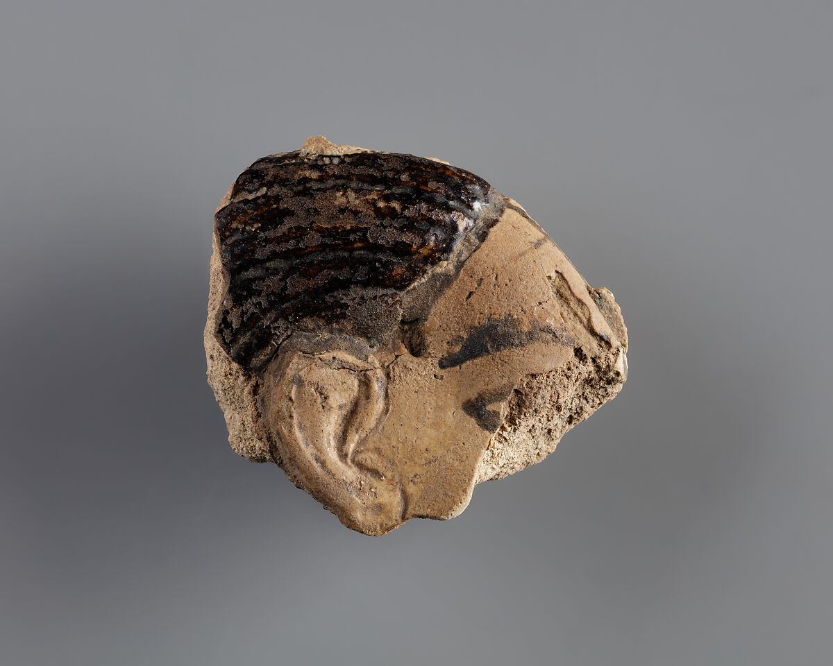 Tile with a fragment of a captive from the palace of Ramesses II, Faience, polychrome 