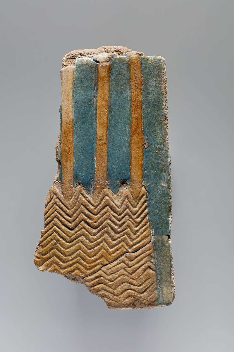 Tile fragment of clumps of sedge and papyrus plants from the palace of Ramesses II, Faience, mortar 