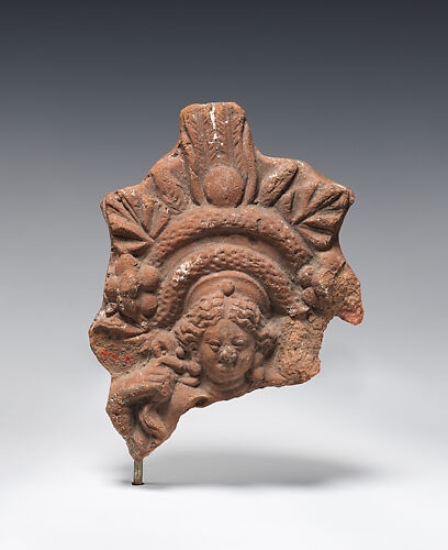 Figurine with elaborate headdress