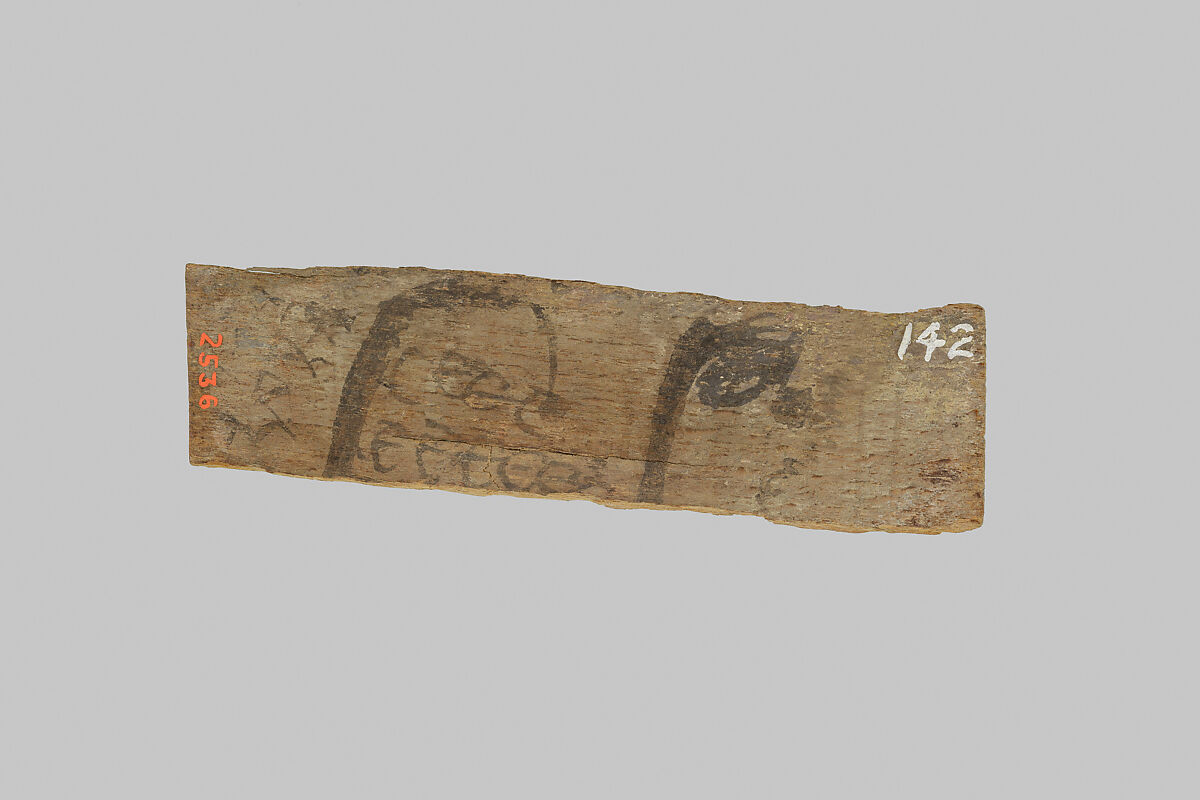 Fragment of a mummy label, Wood, ink 