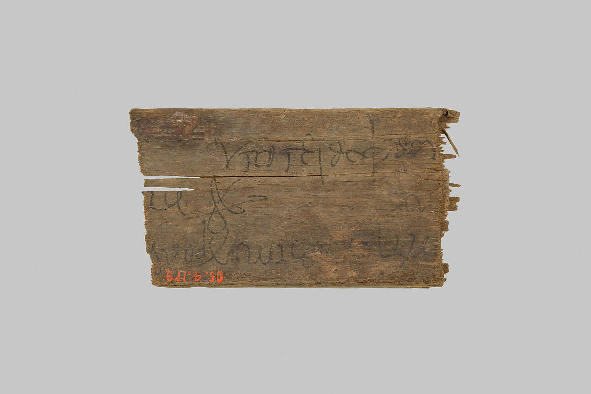 Fragment of a mummy label, Wood, ink 