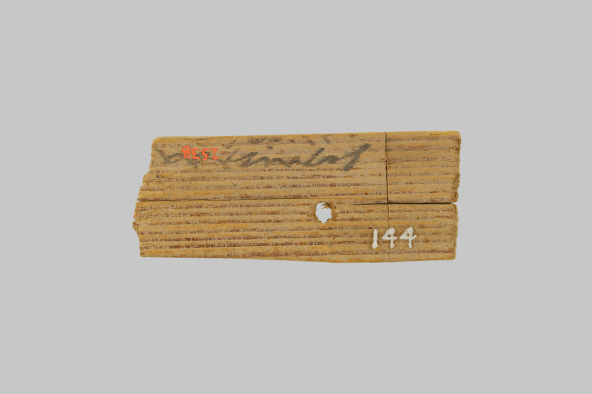 Fragment of a mummy label, Wood, ink 