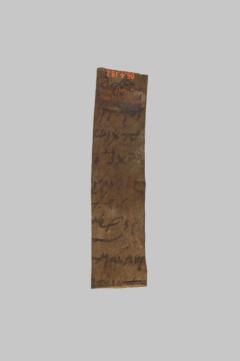 Fragment of a mummy label, Wood, ink 