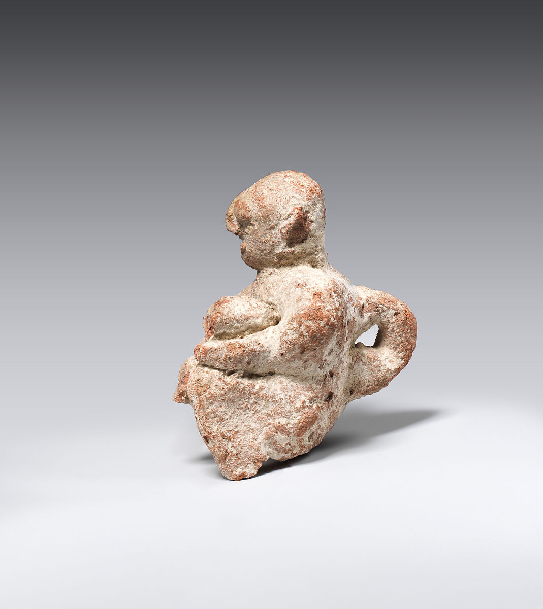 Figure of a seated man, Pottery; paint