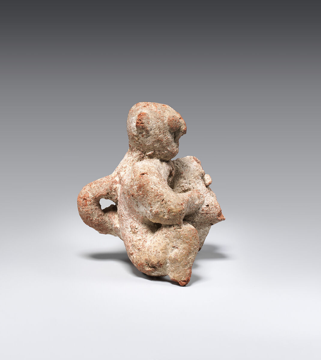 Figure of a seated man, Pottery; paint