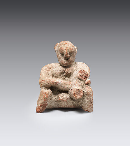 Figure of a seated man
