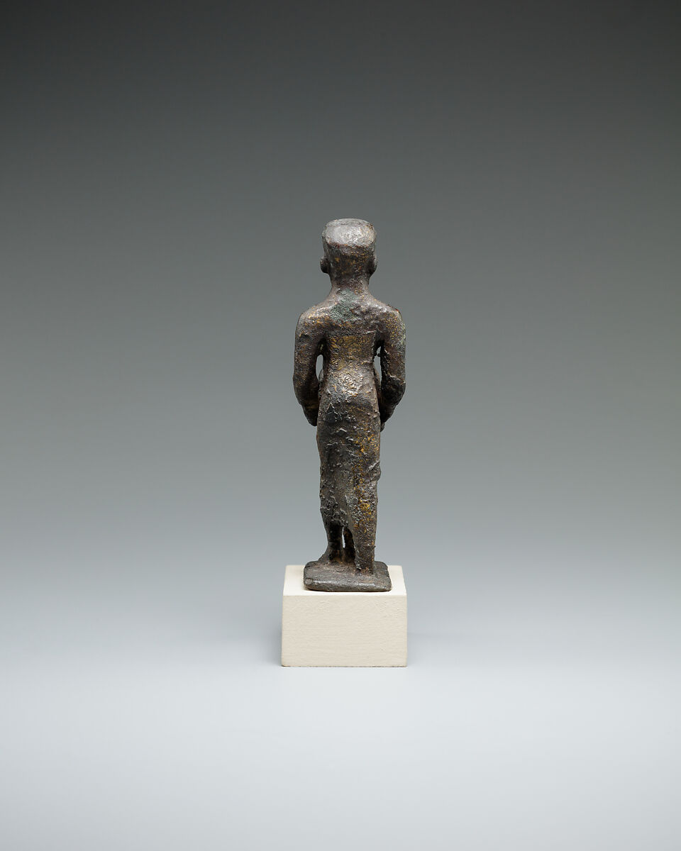 Individual holding a Maat bust on a stand, Bronze or cupreous alloy
