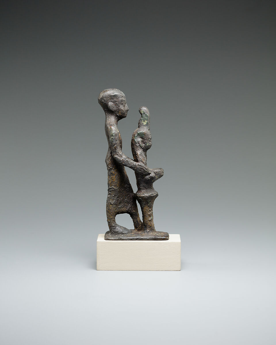 Individual holding a Maat bust on a stand, Bronze or cupreous alloy