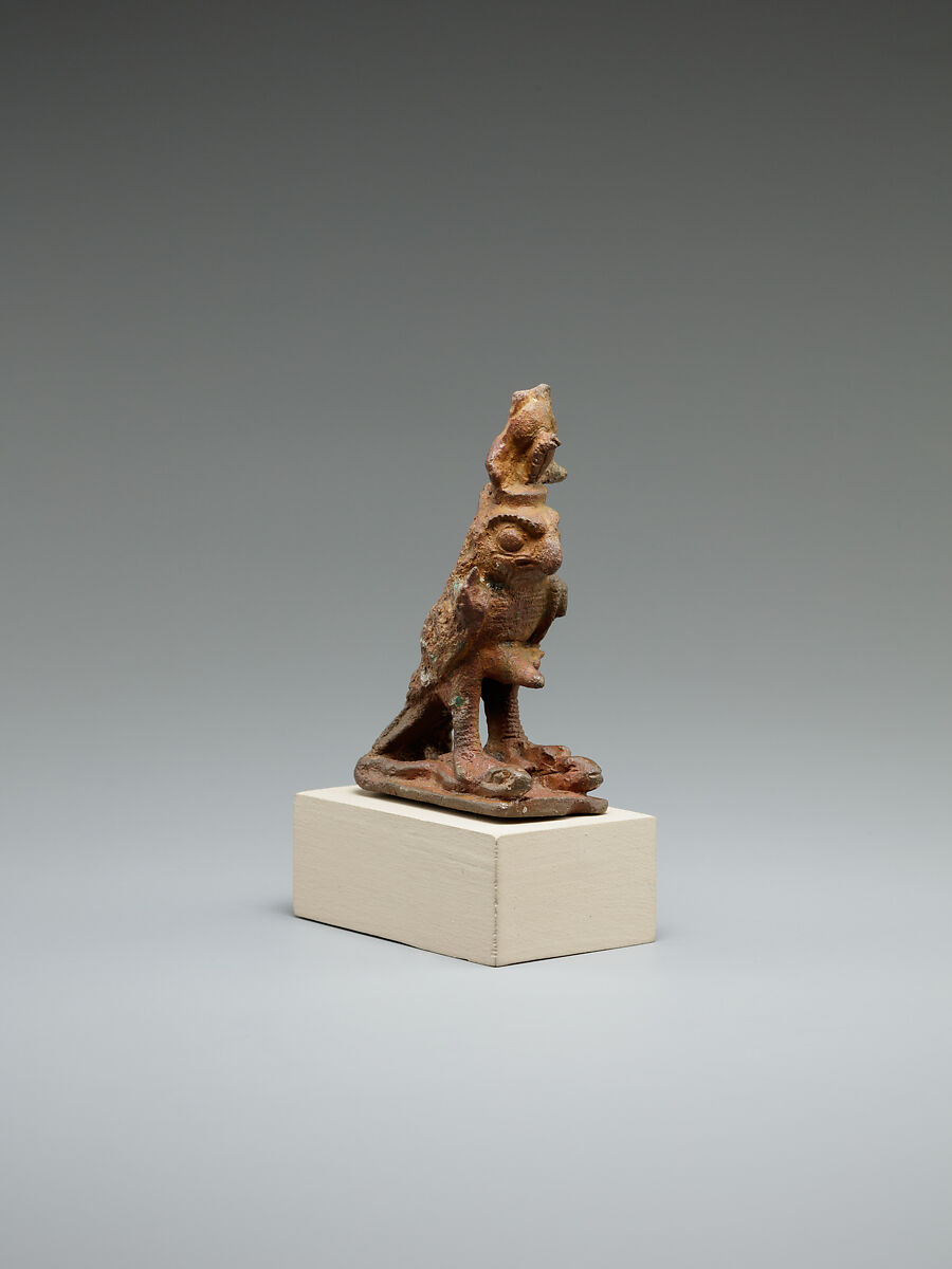 Ithyphallic falcon treading on two snakes, cupreous alloy