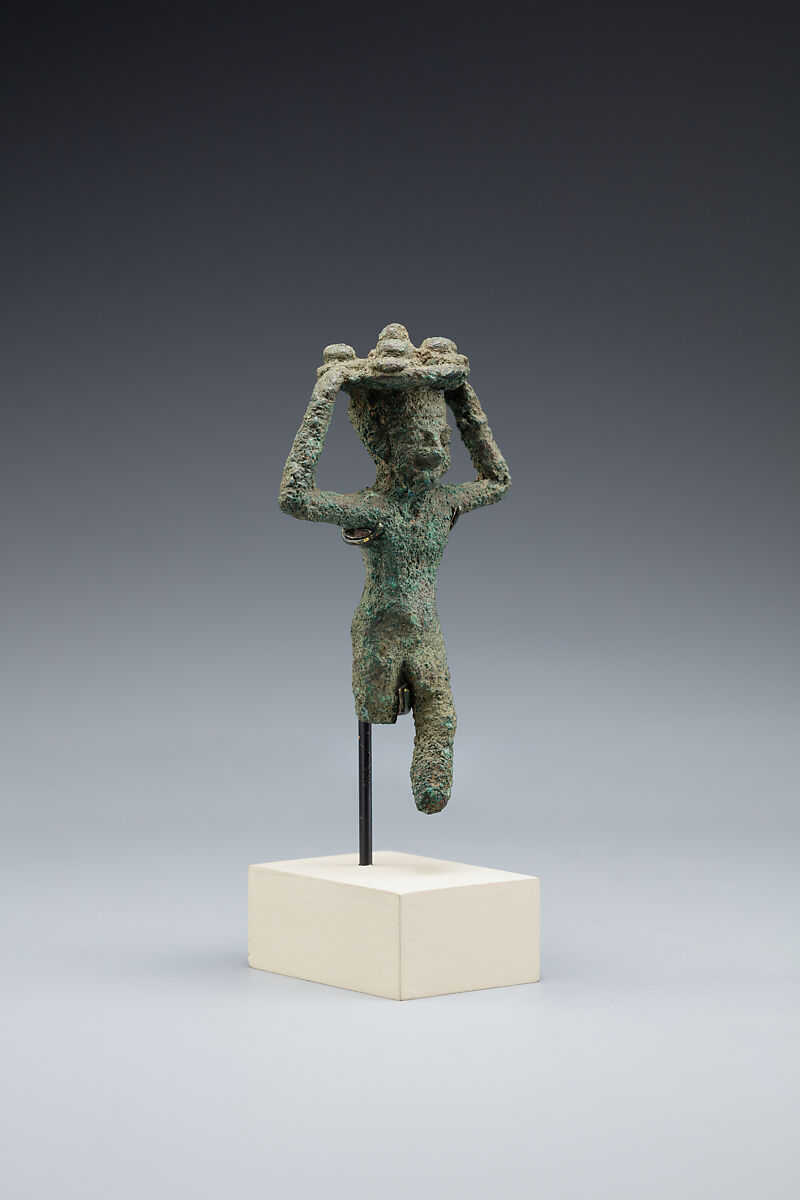 Man carrying a tray of loaves, Cupreous alloy