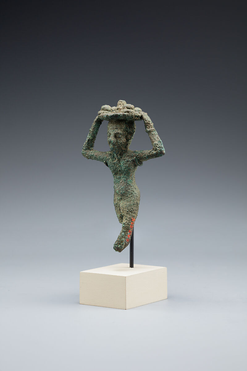 Man carrying a tray of loaves, Cupreous alloy