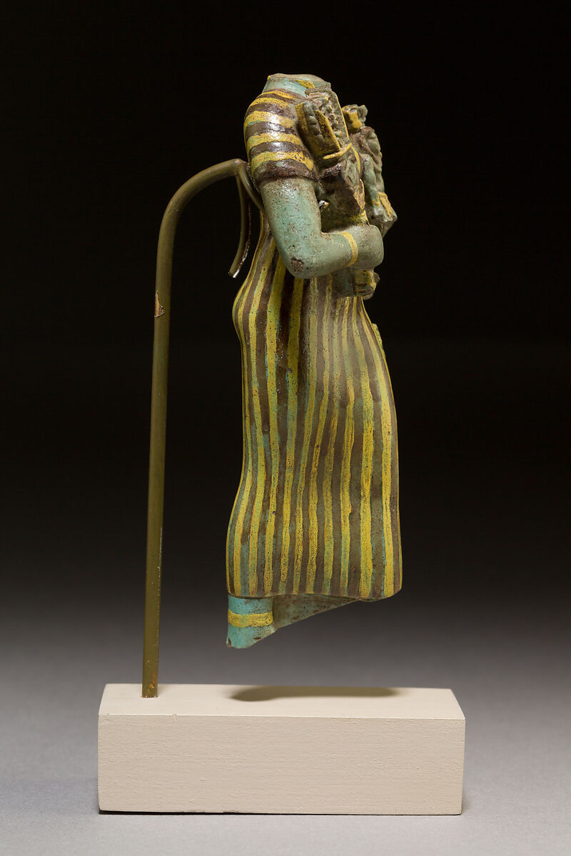 Statuette of Bastet holding a figure of Nefertum, Faience