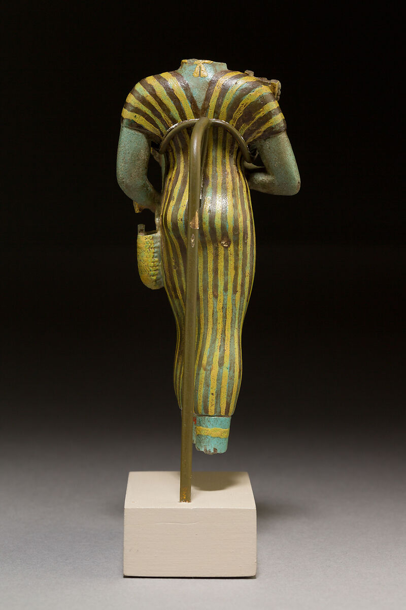Statuette of Bastet holding a figure of Nefertum, Faience