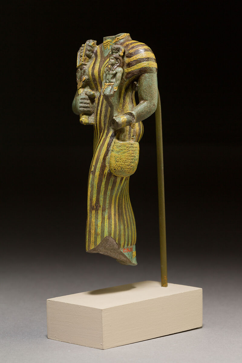 Statuette of Bastet holding a figure of Nefertum, Faience