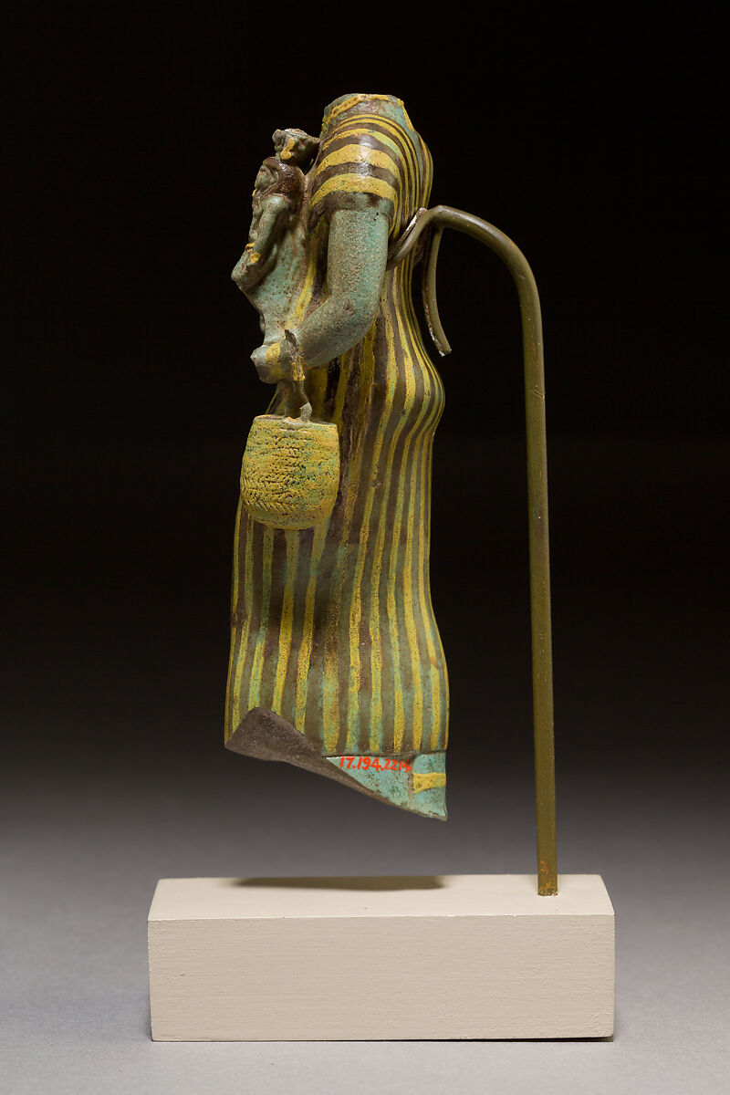 Statuette of Bastet holding a figure of Nefertum, Faience