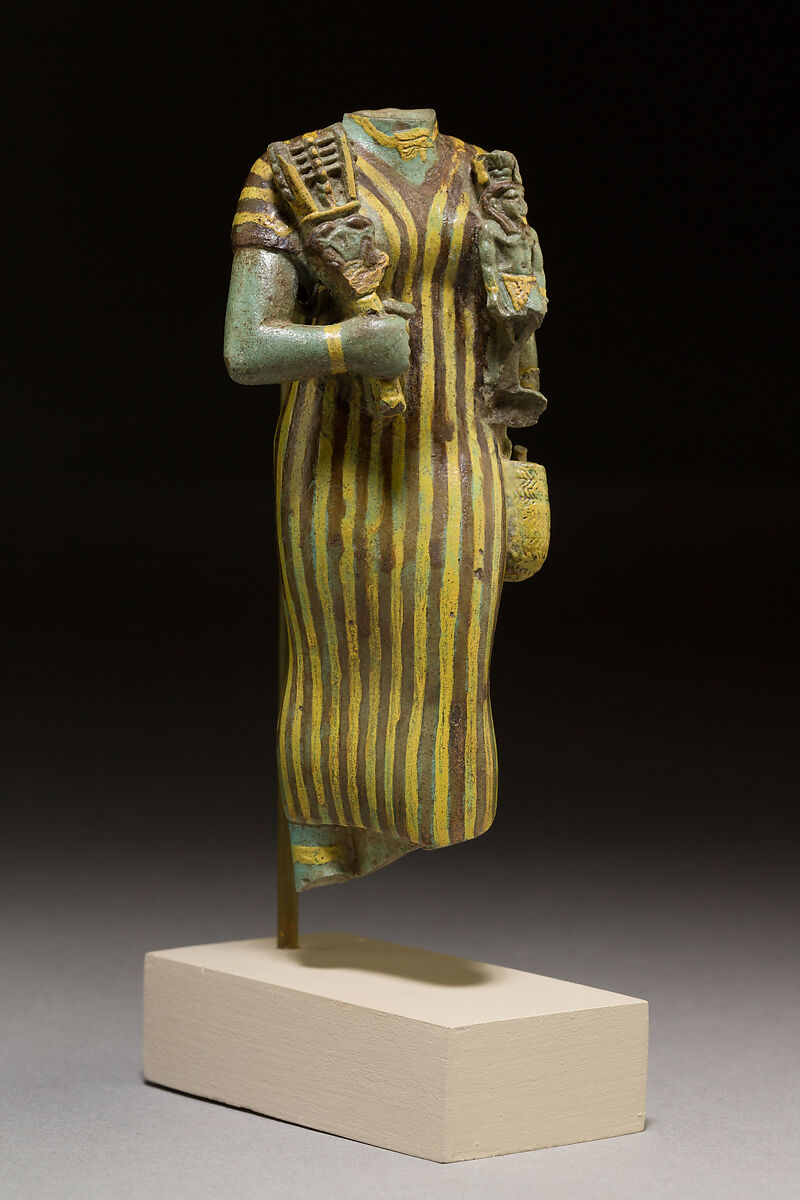 Statuette of Bastet holding a figure of Nefertum, Faience