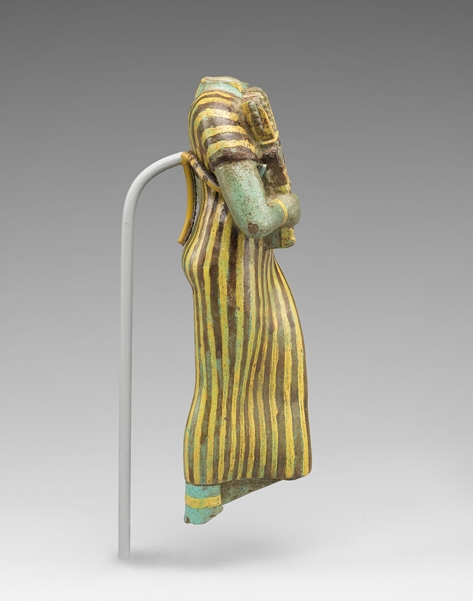 Statuette of Bastet holding a figure of Nefertum, Faience