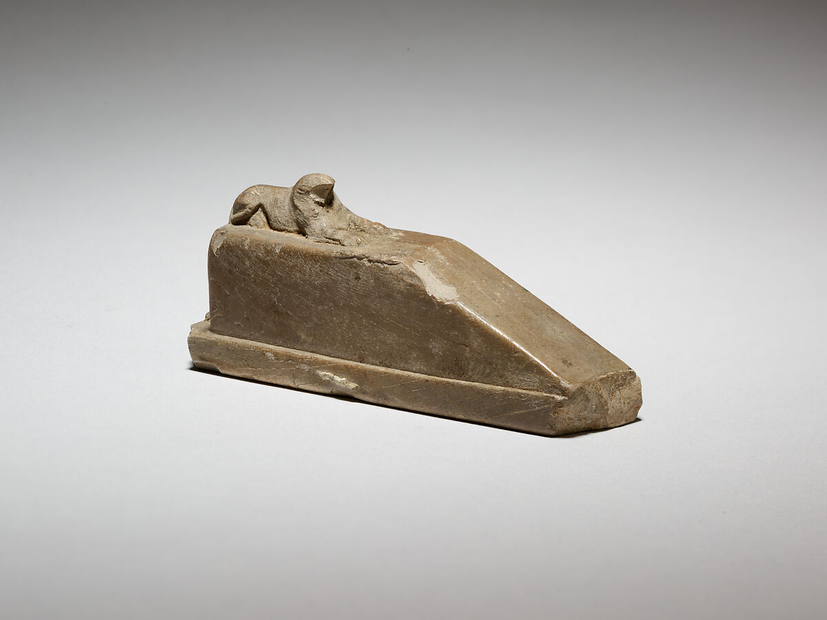Falcon-headed sphinx recumbent on a pedestal with a ramp, and a feline(?) behind, possibly a gnomon for a shadow clock or instrument, Ivory 