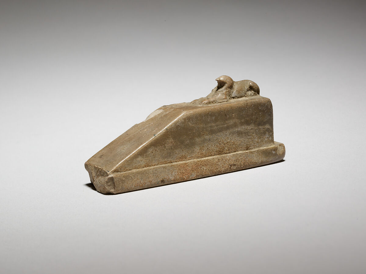 Falcon-headed sphinx recumbent on a pedestal with a ramp, and a feline(?) behind, possibly a gnomon for a shadow clock or instrument, Ivory