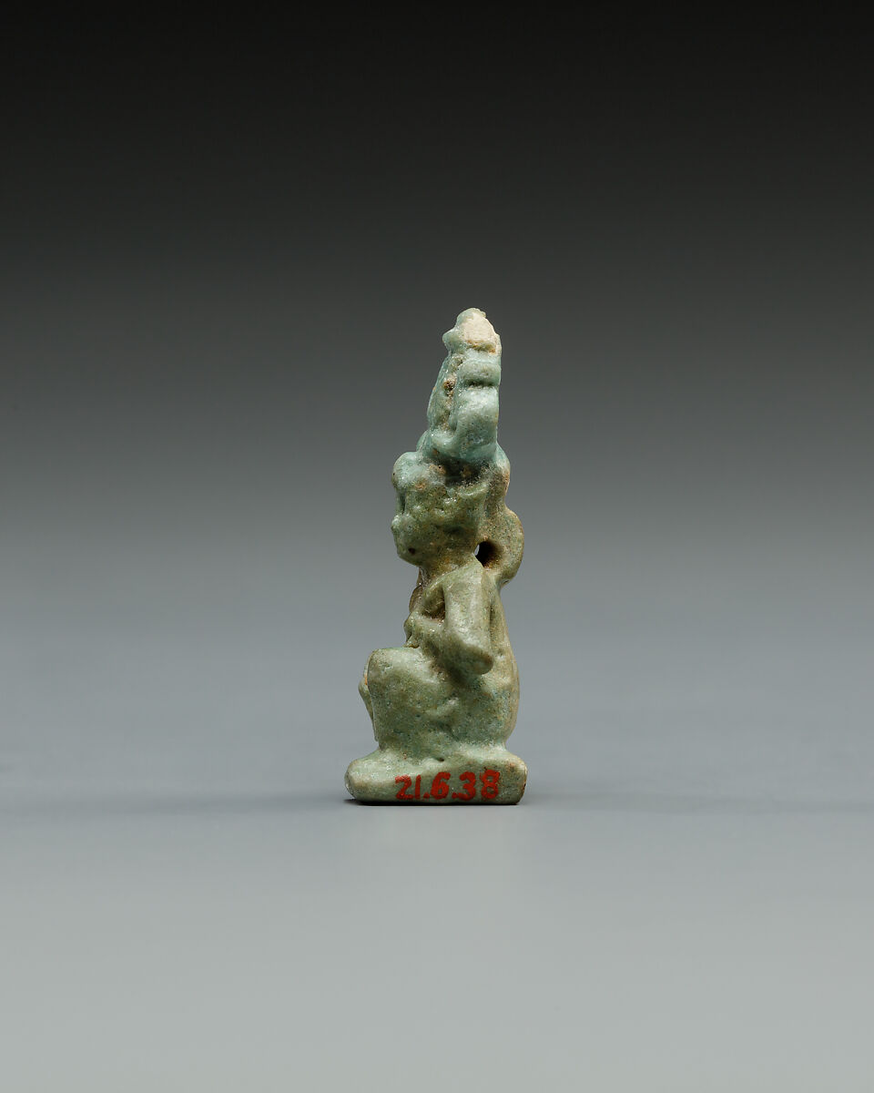 Squatting Harpokrates with hemhem and flail, Faience
