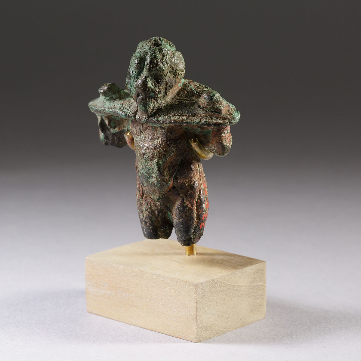 Figure imprisoned by a restraint, Cupreous metal