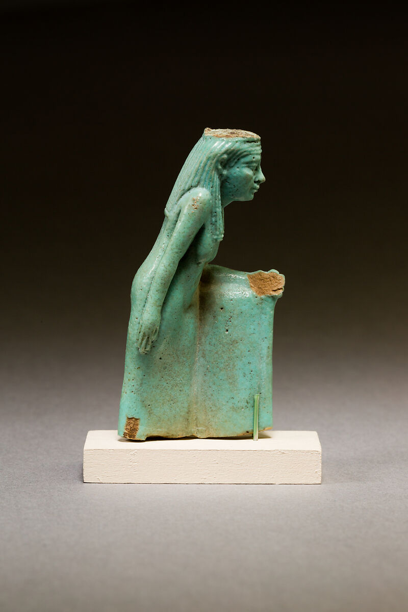Statuette of a worn or aged woman, probably a goddess, Faience